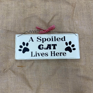 shabby chic hanging sign with the message 'A Spoiled Cat Lives Here'